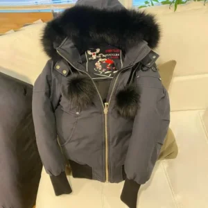 Women's red Moose Knuckles winter down jacket.